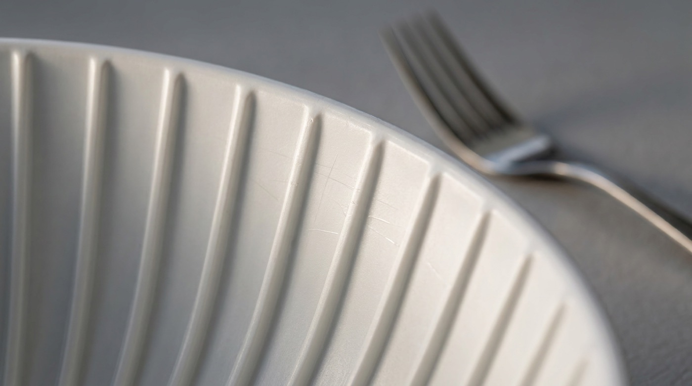 Fine cutlery marks on the tops of the ribs.